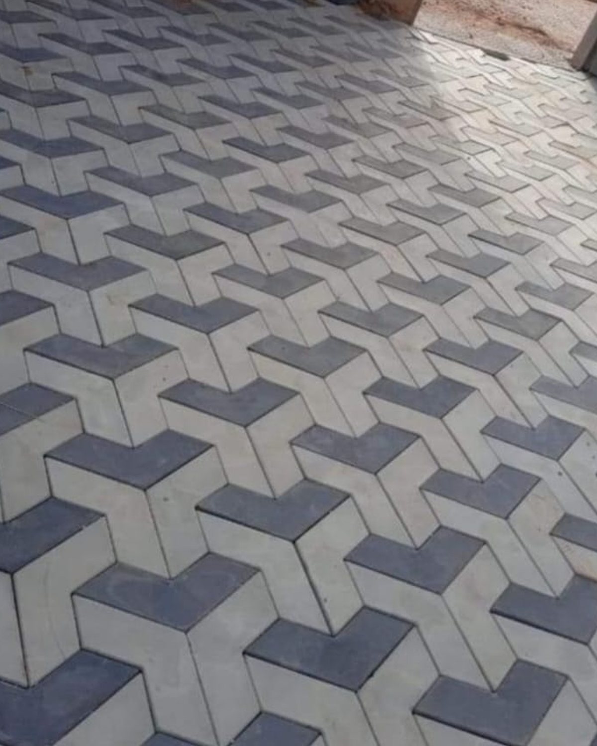 Cour intérieure en Pavé 3D chevron, relief marqué gris et bleu